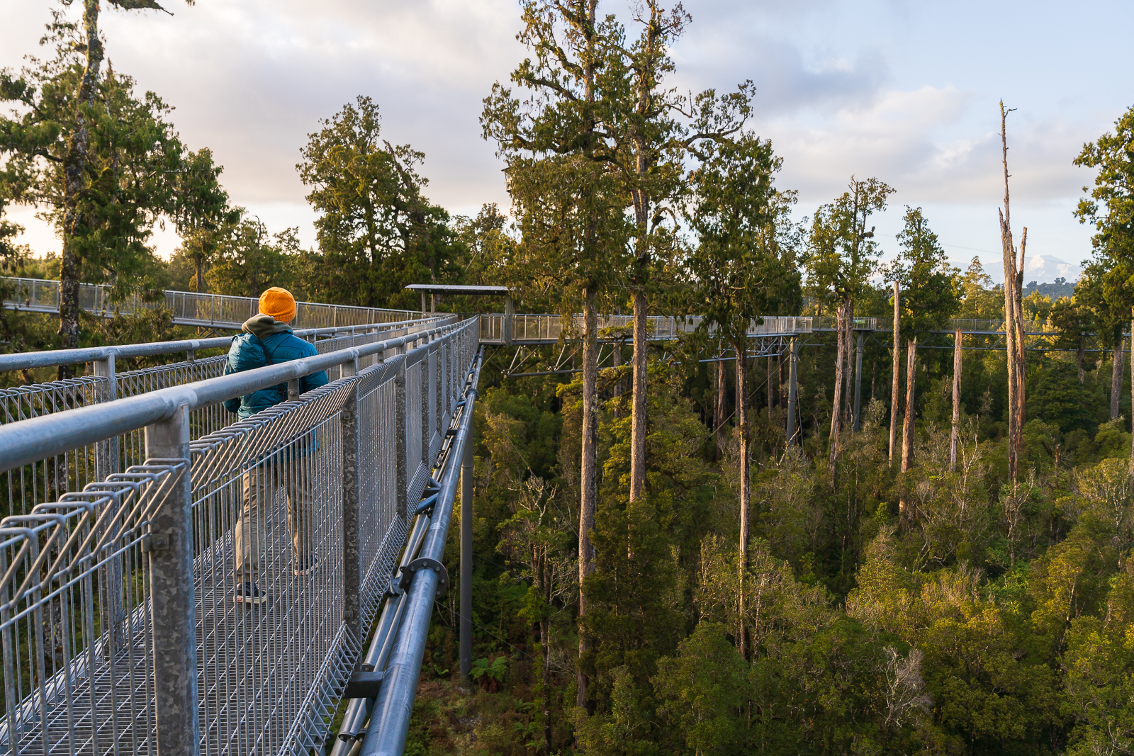 Man Walking on Bridge